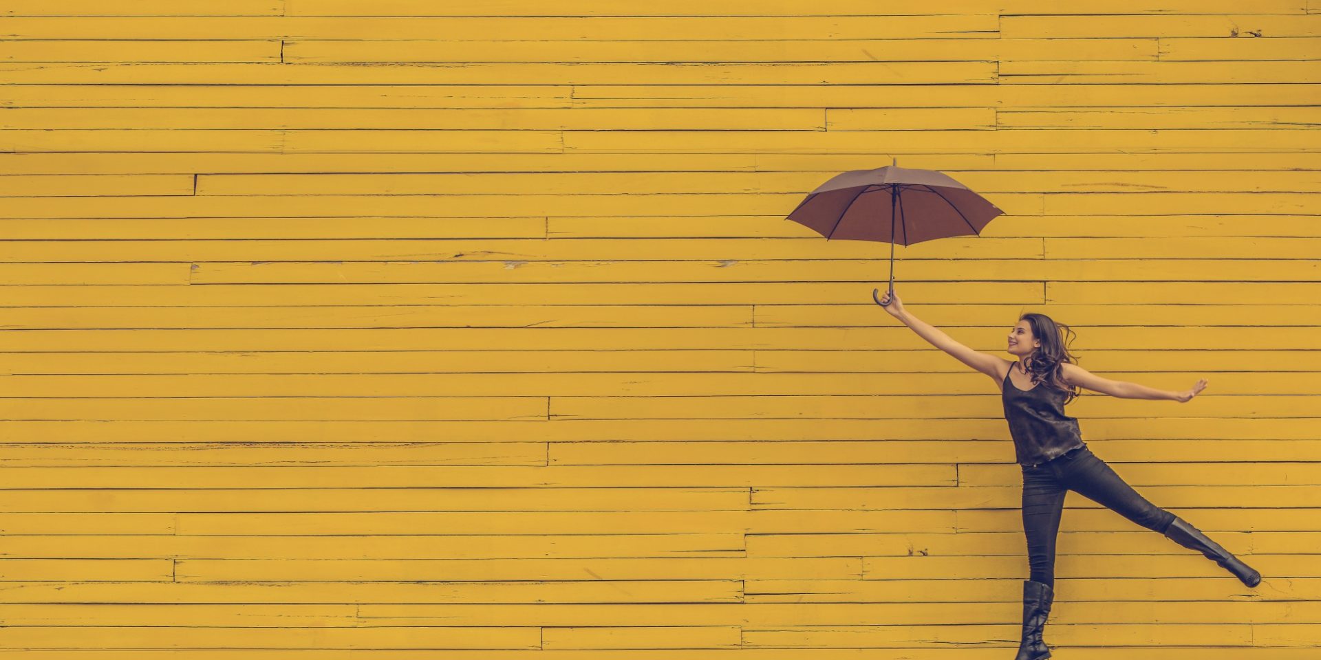 Happy Nest Nanny holding umbrella childminder blog